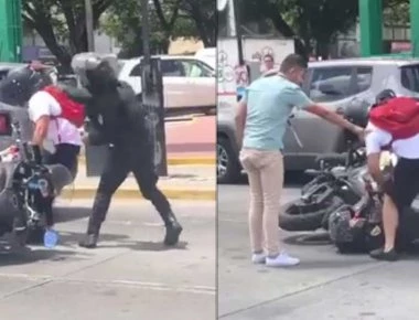 Οδηγός μηχανής σπάει στο ξύλο αστυνομικό - Bίντεο